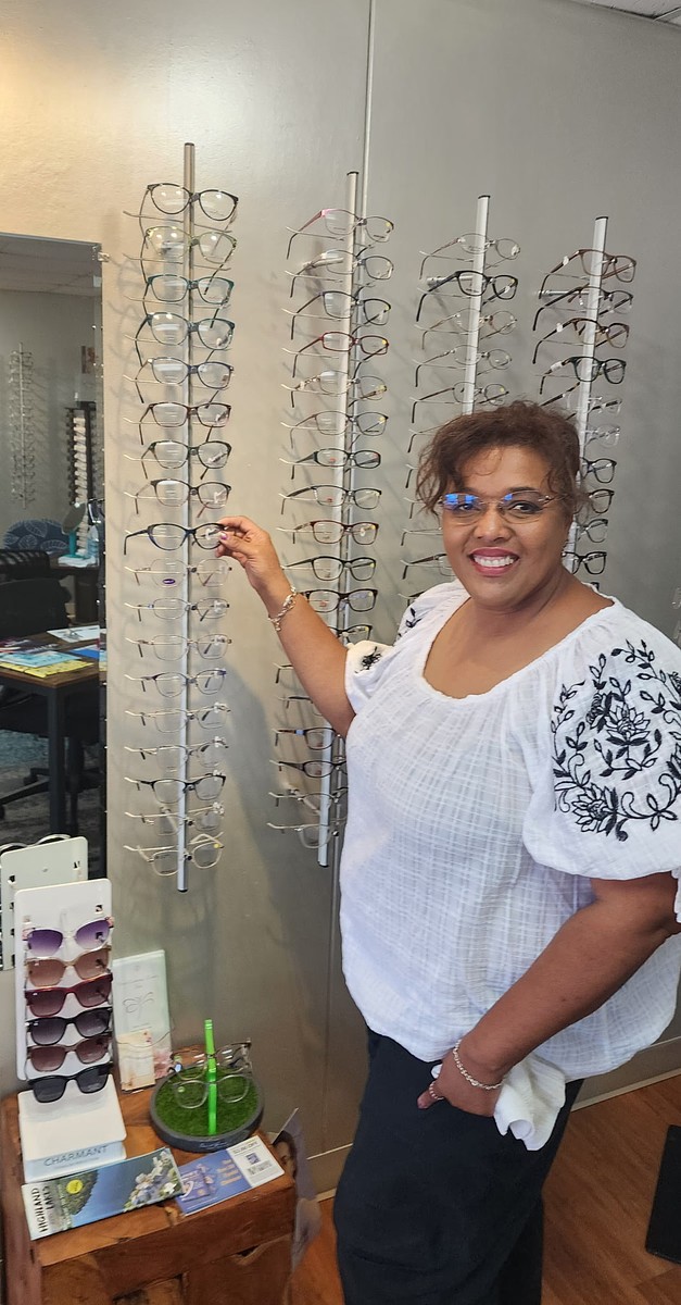 Wall of prescription eyeglass frames for men and women on display inside Andrea Baker Optical in Burnet, TX